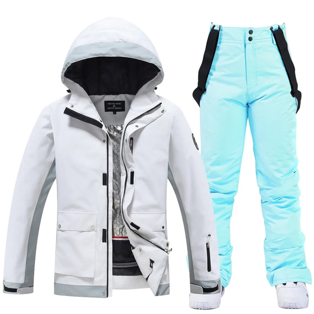 Couple White Athletic Ski Jackets And Ski Bibs Trousers