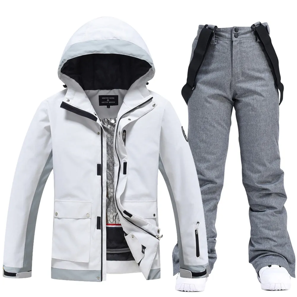 Couple White Athletic Ski Jackets And Ski Bibs Trousers