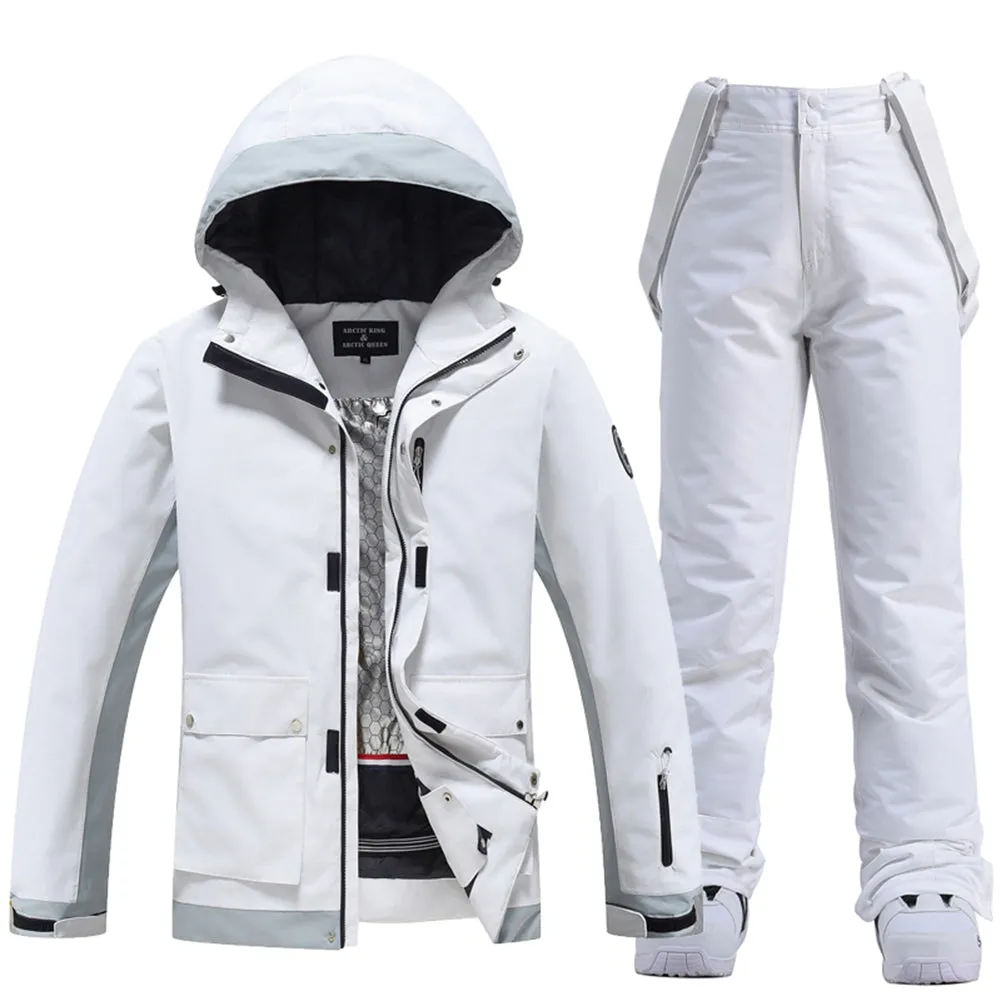 Couple White Athletic Ski Jackets And Ski Bibs Trousers